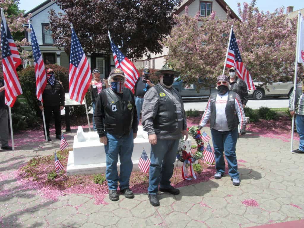 Patriot Guard Riders, a motorcycle troop, place wreath honoring vets.