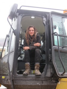 Emily Gorham sits in her excavator.