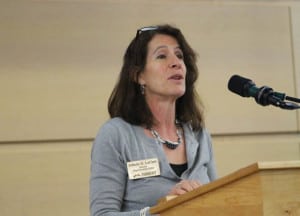 Jolinda LaClair speaking at a podium